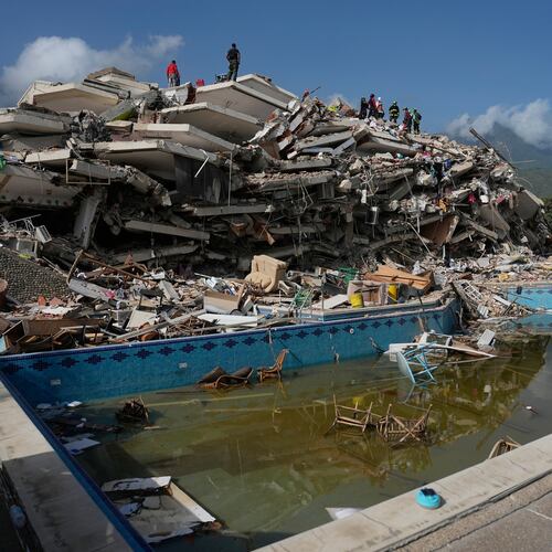 Rescue workers search through the rubble three days after earthquakes struck Catia La Mar, Venezuela, Saturday, June 27, 2026. (AP Photo/Fernando Vergara)