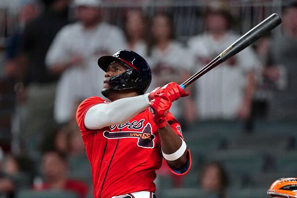 Atlanta Braves' Jorge Soler watches his three-run home run during the eighth inning of the team's baseball game against the San Francisco Giants on Friday, Aug. 27, 2021, in Atlanta. (AP Photo/John Bazemore)