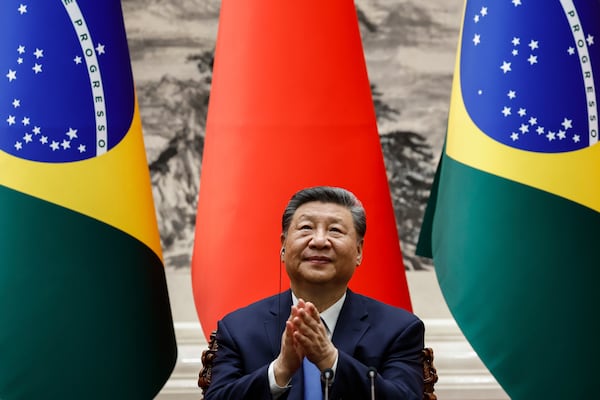Chinese President Xi Jinping applauds after a a joint press conference with Brazil's President Luiz Inacio Lula da Silva (not pictured) at the Great Hall of the People in Beijing, China, Tuesday, May 13, 2025. (Tingshu Wang/Pool Photo via AP)