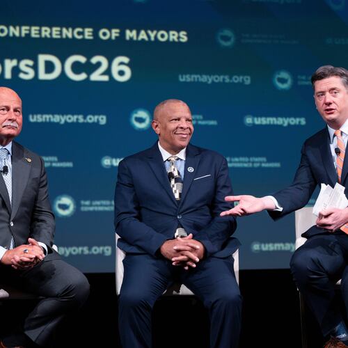 Oklahoma City Mayor David Holt, right, speaks during a panel discussion with Fresno, Calif. Mayor Jerry Dyer, left, and Omaha, Neb. Mayor John Ewing, Jr. during the 94th Winter Meeting of the U.S. Conference of Mayors, Wednesday, Jan. 28, 2026 in Washington. (AP Photo/Kevin Wolf)