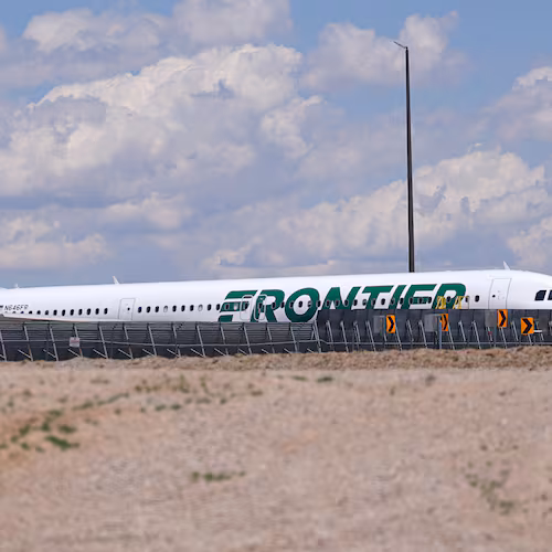 Frontier Airlines jetliner number n646fr sits outside the airlines technical operations center with other jetliners in for service north of Denver International Airport Saturday, May 9, 2026, in Denver. (AP Photo/David Zalubowski)