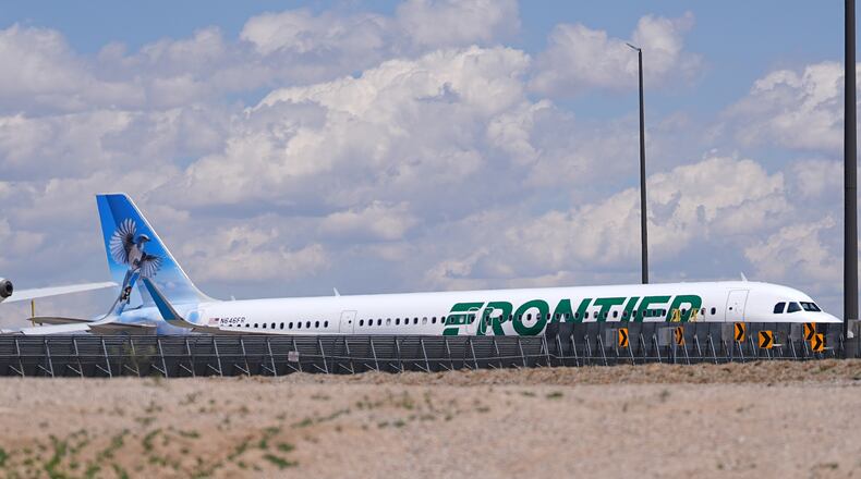 Frontier Airlines jetliner number n646fr sits outside the airlines technical operations center with other jetliners in for service north of Denver International Airport Saturday, May 9, 2026, in Denver. (AP Photo/David Zalubowski)
