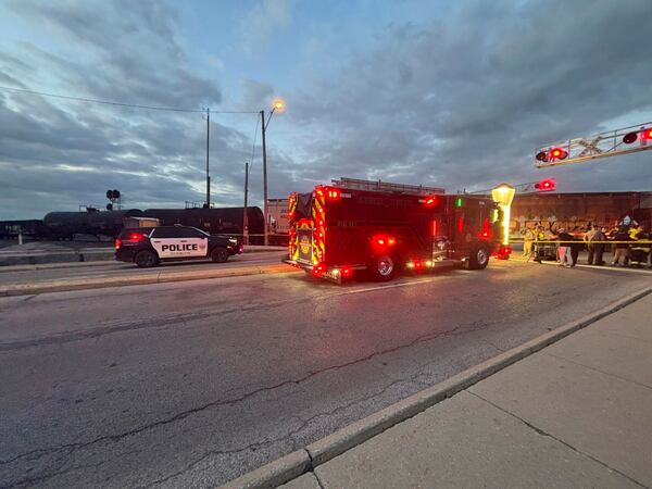 In this photo provided by Emerson Young, first responders are at the scene where a train sits idle on tracks after striking multiple pedestrians Sunday evening, May 18, 2025, in Fremont, Ohio. (Emerson Young via AP)