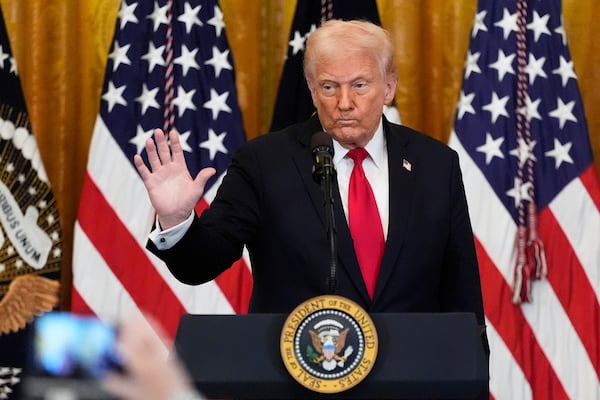 President Donald Trump waves after speaking at a reception celebrating Women's History Month in the East Room of the White House, Wednesday, March 26, 2025, in Washington. (AP Photo/Mark Schiefelbein)