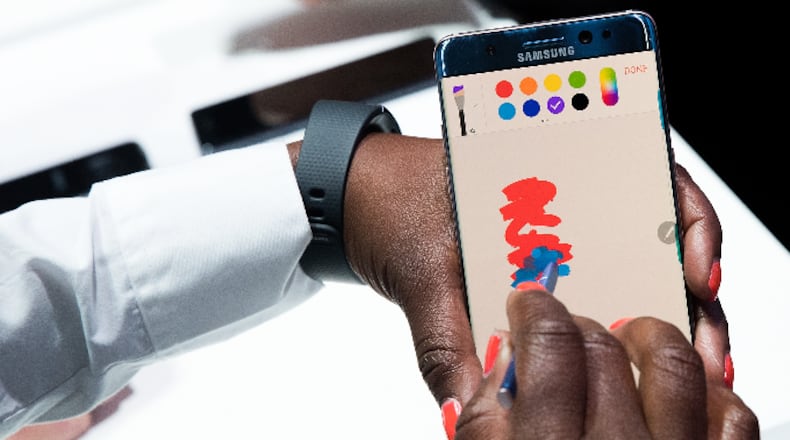 A Samsung employee uses a stylus on a Samsung Galaxy Note 7 smartphone during a launch event for the Samsung Galaxy Note 7 in New York City.