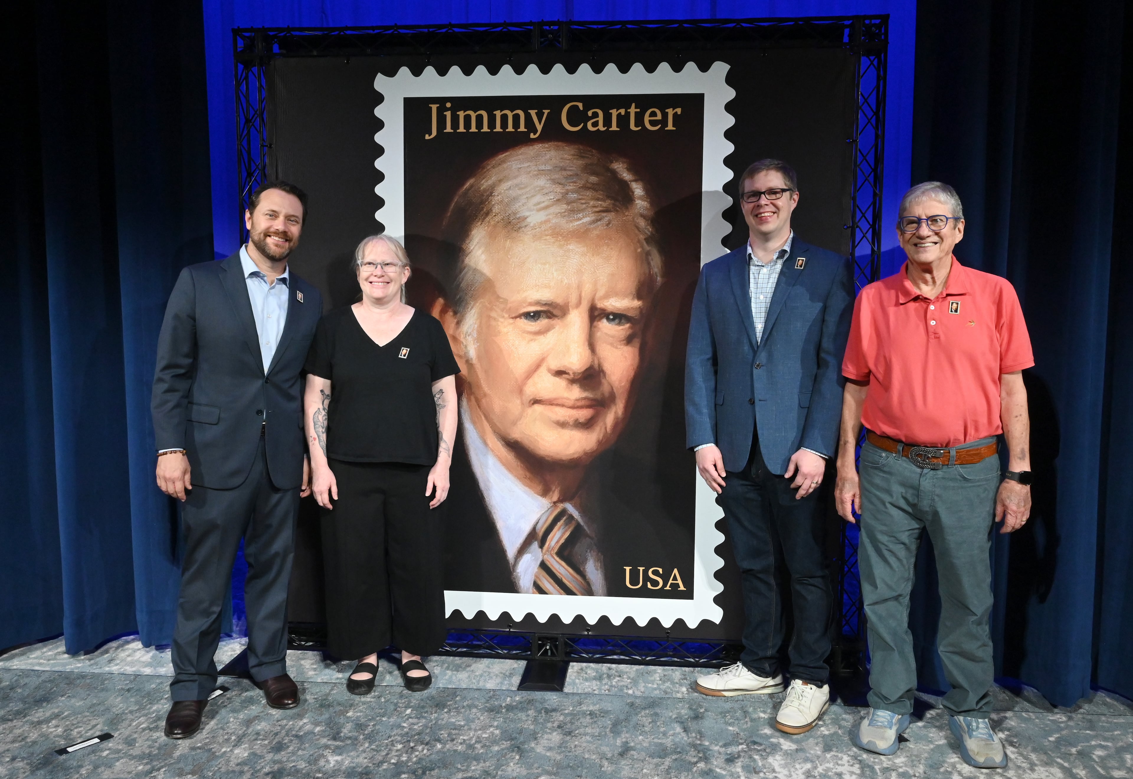 Jason Carter, grandson of the Carters (from left); Amy Carter, daughter of Jimmy and Rosalyn Carter; Josh Carter, grandson of the Carters; and James "Chip" Carter, son of Jimmy and Rosalynn Carter, all attended the unveiling ceremony Wednesday at the Carter Center. Hyosub Shin/AJC)