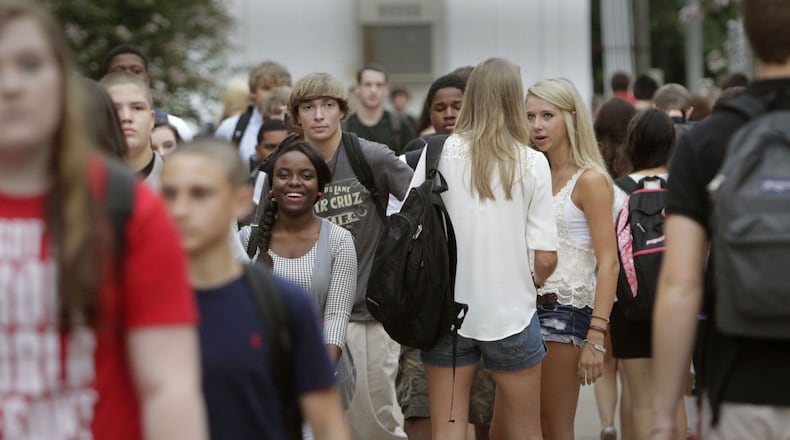 August 6, 2012 - Students stream through North Gwinnett High School during a class break on the first day of school.
