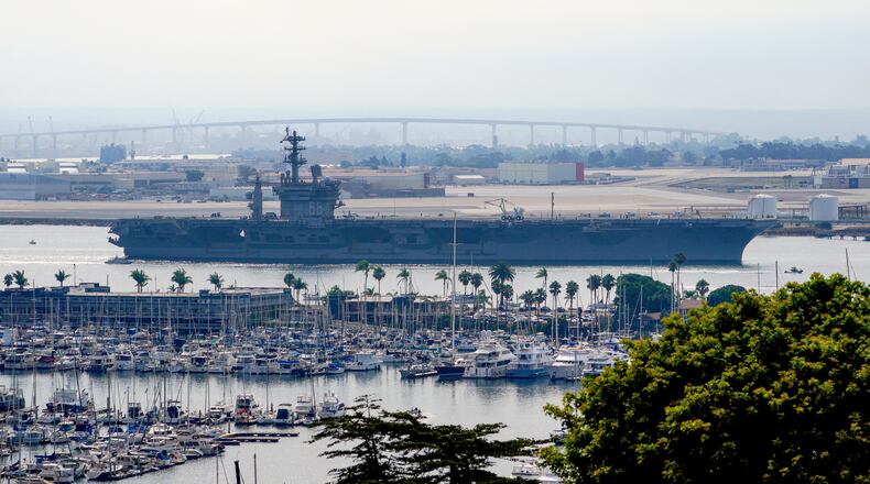 FILE - The USS Nimitz (CVN 68) departs San Diego Bay, Aug. 19, 2023, at Mission Beach, in San Diego. (Nelvin C. Cepeda/The San Diego Union-Tribune via AP, File)