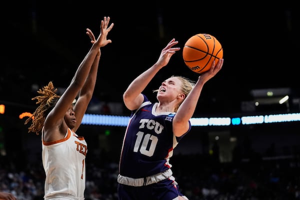 TCU guard Hailey Van Lith (10)m shoots against Texas guard Bryanna Preston (1) during the second half in the Elite Eight of the NCAA college basketball tournament, Monday, March 31, 2025. in Birmingham, Ala. (AP Photo/Gerald Herbert)