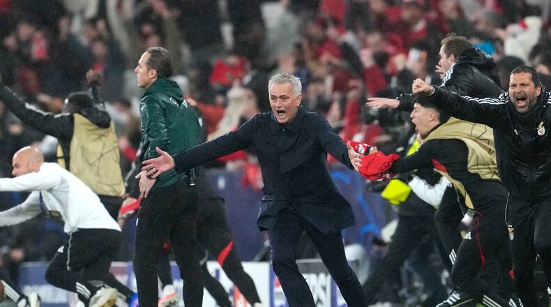 Benfica's head coach Jose Mourinho runs celebrating at the end of a Champions League opening phase soccer match between Benfica and Real Madrid, in Lisbon, Wednesday, Jan. 28, 2026. (AP Photo/Armando Franca)