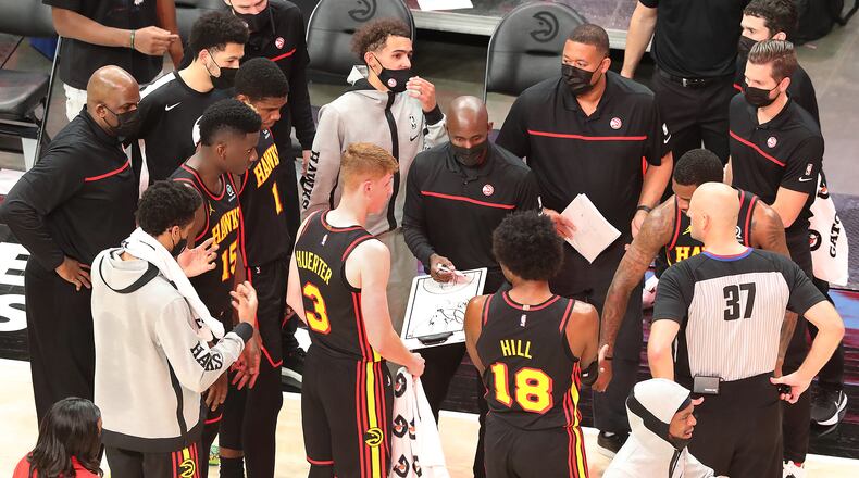 011121 Atlanta: Atlanta Hawks head coach Lloyd Pierce circles up his team during a 112-94 victory over the Philadelphia 76ers in a NBA basketball game on Monday, Jan. 11, 2021, in Atlanta.  Curtis Compton / Curtis.Compton@ajc.com”