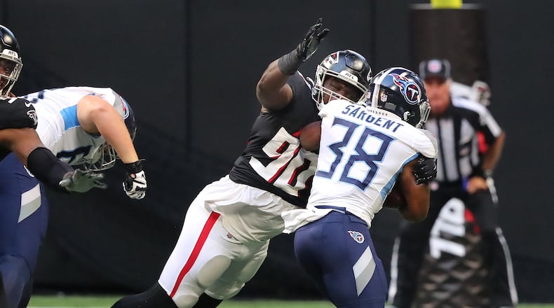 081321 Atlanta: Atlanta Falcons defensive lineman Marlon Davidson tackles Tennessee Titans running back Mekhi Sargent during the first half of a NFL preseason football game on Friday, August 13, 2021, in Atlanta. “Curtis Compton / Curtis.Compton@ajc.com”