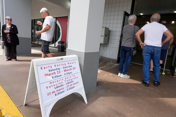 Early voters line up outside the Supervisor of Elections office Tuesday, March 25, 2025, in DeLand, Fla. (AP Photo/John Raoux)