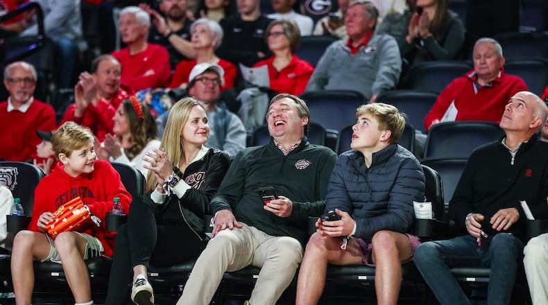 Georgia football coach Kirby Smart and his family enjoy a basketball game against Mississippi State at Stegeman Coliseum in Athens, Ga., on Wednesday, Jan. 11, 2023. (Photo by Tony Walsh / UGA Athletics)