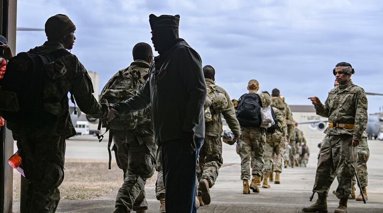 U.S Army troops prepare to board a C-17 transport aircraft headed for Eastern Europe, at Fort Bragg, N.C., Feb. 3, 2022. (Kenny Holston/The New York Times)