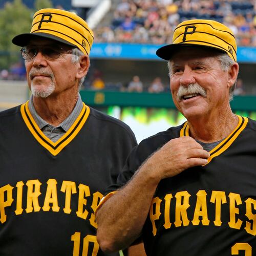 FILE - Tim Foli, left, and Phil Garner, the middle infield of the 1979 World Championship Pittsburgh Pirates team attend a pre-game ceremony remembering the team's accomplishment 40 years ago before a baseball game between the Pittsburgh Pirates and the Philadelphia Phillies in Pittsburgh, July 20, 2019. (AP Photo/Gene J. Puskar, File)