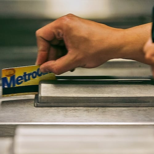 FILE - A subway rider swipes his MetroCard in a turnstile as he enters the 34th St. subway station, July 23, 2007, in New York. (AP Photo/Mary Altaffer, File)