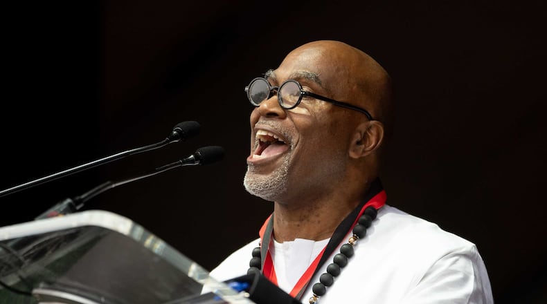 Daniel Black, an associate professor of African American studies at Clark Atlanta University, delivers the commencement address at the school on May 18, 2024. (Ben Hendren for The Atlanta Journal-Constitution)