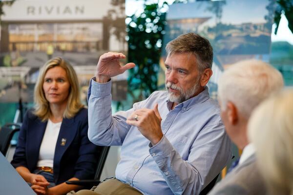 Tony Sanger, Rivian’s vice president for production facilities in Georgia, along with Claire McDonough, chief financial officer, answers questions from the press after a tour of Rivian’s East Coast headquarters in Atlanta on Tuesday, Aug. 4, 2026. (Miguel Martinez/AJC)