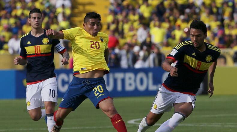 FILE - Ecuador's Mario Pineida, center, and Colombia's Abel Aguilar battle for the ball during their 2018 World Cup qualifying soccer match at the Atahualpa Olympic Stadium in Quito, Ecuador, March 28, 2017. (AP Photo/Dolores Ochoa, File)