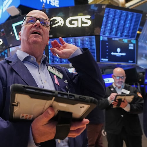 Trader Patrick Casey works on the floor of the New York Stock Exchange, Wednesday, May 13, 2026. (AP Photo/Richard Drew)
