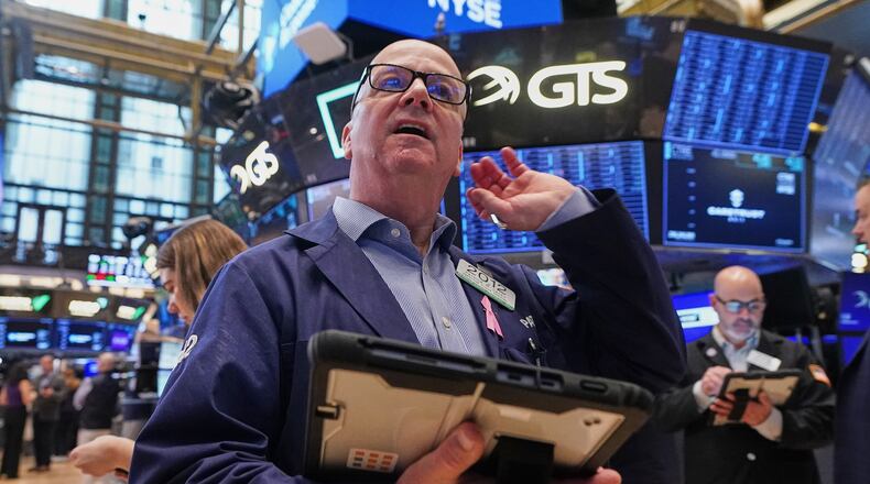 Trader Patrick Casey works on the floor of the New York Stock Exchange, Wednesday, May 13, 2026. (AP Photo/Richard Drew)