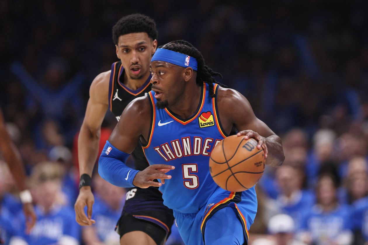 Oklahoma City Thunder guard Luguentz Dort leads a fast break in front of Phoenix Suns forward Ryan Dunn during the second half in Game 1 of a first-round NBA playoffs basketball series Sunday, April 19, 2026, in Oklahoma City. (Nate Billings/AP)