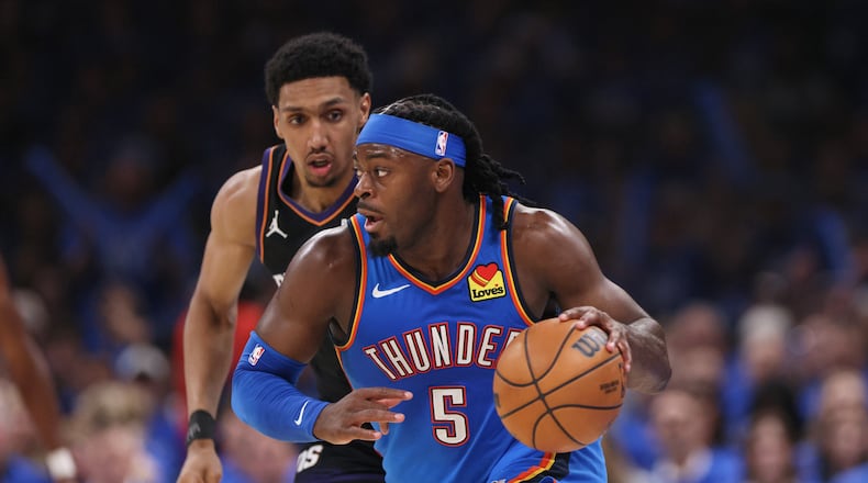 Oklahoma City Thunder guard Luguentz Dort leads a fast break in front of Phoenix Suns forward Ryan Dunn during the second half in Game 1 of a first-round NBA playoffs basketball series Sunday, April 19, 2026, in Oklahoma City. (Nate Billings/AP)