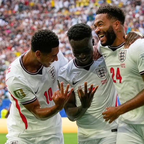 England's Bukayo Saka (7) is congratulated by Jude Bellingham (10) and Reece James (24) after scoring his side's 5th goal from the penalty spot during the World Cup third-place playoff soccer match between France and England in Miami Gardens, Fla., Saturday, July 18, 2026. (AP Photo/Lynne Sladky)