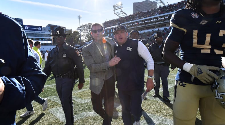 November 27, 2021 Atlanta - Georgia TechÕs athletic director Todd Stansbury comforts Georgia Tech's head coach Geoff Collins after Georgia defeated Georgia Tech in an NCAA college football game at Georgia Tech's Bobby Dodd Stadium in Atlanta on Saturday, November 27, 2021.  (Hyosub Shin / Hyosub.Shin@ajc.com)