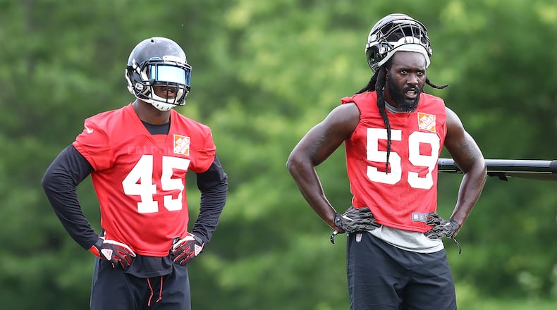 Linebackers Deion Jones (left) and De'Vondre Campbell are often in the same frame when on the field - or off. (Curtis Compton/ccompton@ajc.com)