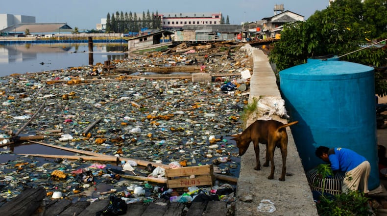 Plastic trash along a seawall in Jakarta in May 2018. (Photo by Ed Wray/Getty Images)