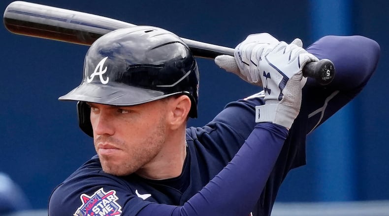 Entering Sunday's game Atlanta Braves first baseman Freddie Freeman (5) had just five hits in 14 spring games. (John Bazemore/AP)