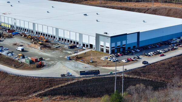 Construction equipment moves on a site last year that will be the future home of ServerFarm's new Data Center in Covington. (Miguel Martinez/ AJC)