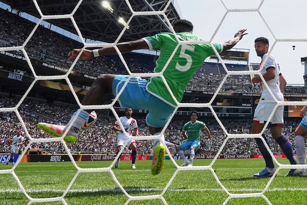 Seattle Sounders' Nouhou Tolo stops a shot by Paris Saint-Germain's Warren Zaire-Emery during the Club World Cup Group B soccer match between Seattle Sounders and PSG in Seattle, Monday, June 23, 2025. (AP Photo/Lindsey Wasson)