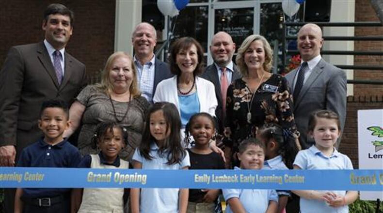Among those attending the Aug. 30 ribbon-cutting ceremony for the Emily Lembeck Early Learning Center were (L-R) Marietta City Schools (MCS) Superintendent Dr. Grant Rivera; Marietta Board of Education members Irene Berens and Randy Weiner; former MCS Superintendent Dr. Emily Lembeck and Marietta Board of Education members Jason Waters, Kerry Minervini and Alan Levine with some of the school’s 117 four-year-olds. Courtesy of Marietta City Schools