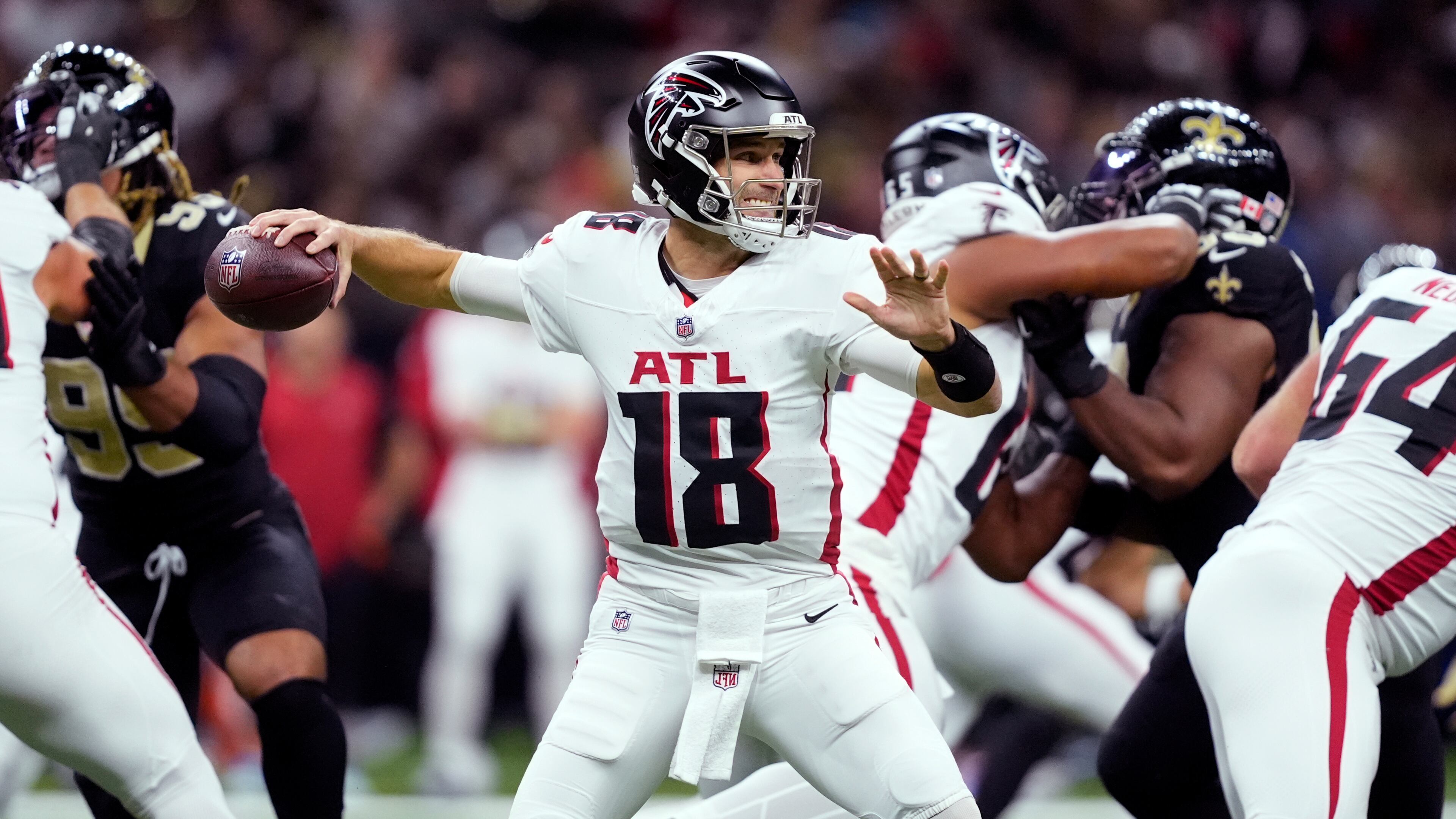 Atlanta Falcons quarterback Kirk Cousins drops back to pass against the New Orleans Saints in the first half of an NFL football game, Sunday, Nov. 23, 2025, in New Orleans. (AP Photo/Gerald Herbert)