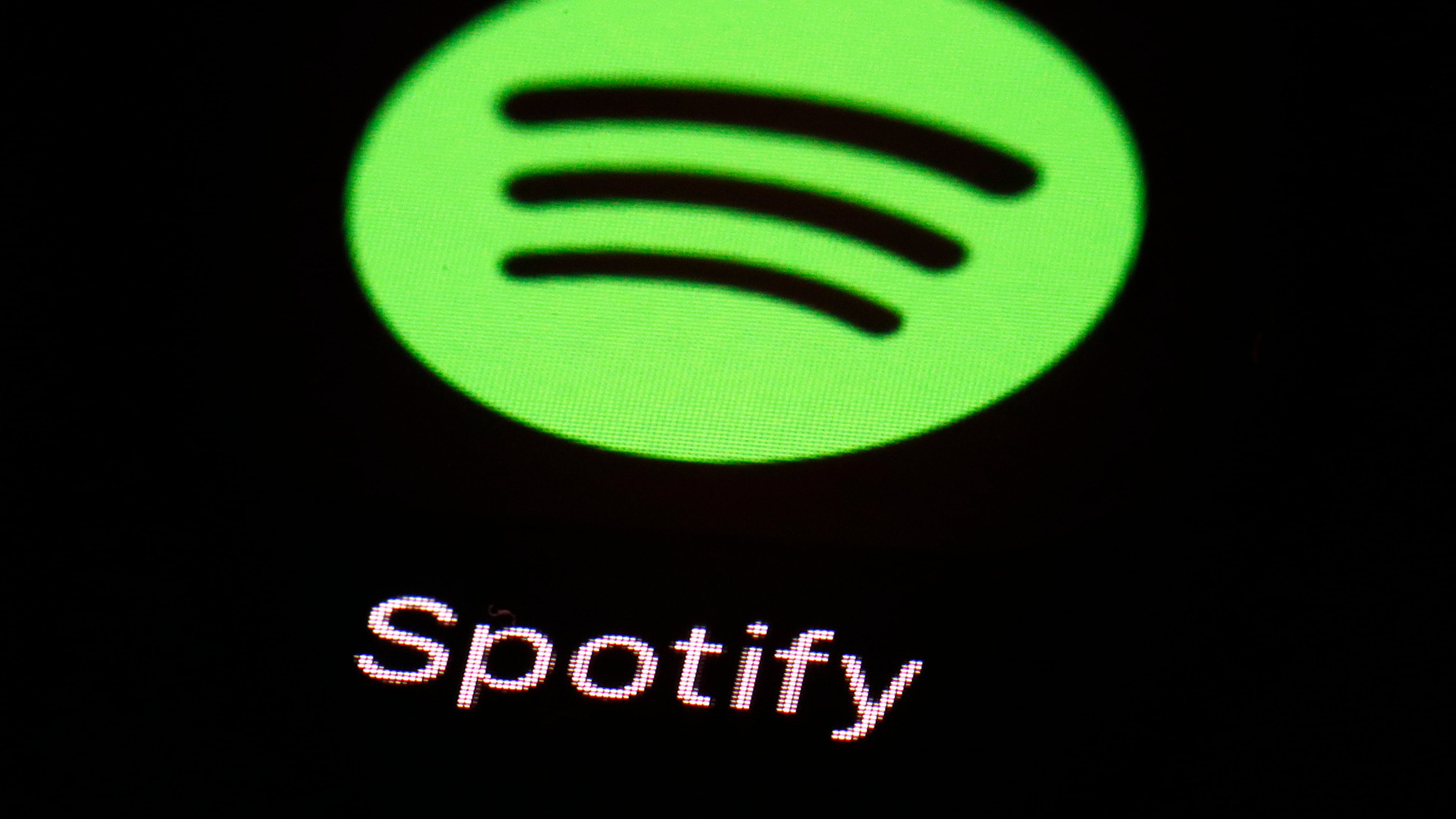 FILE- This March 20, 2018 file photo shows the Spotify app on an iPad in Baltimore. (AP Photo/Patrick Semansky, File)