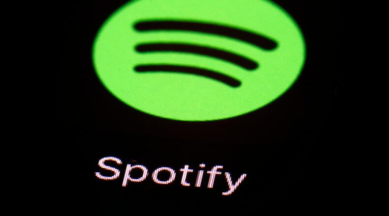 FILE- This March 20, 2018 file photo shows the Spotify app on an iPad in Baltimore. (AP Photo/Patrick Semansky, File)