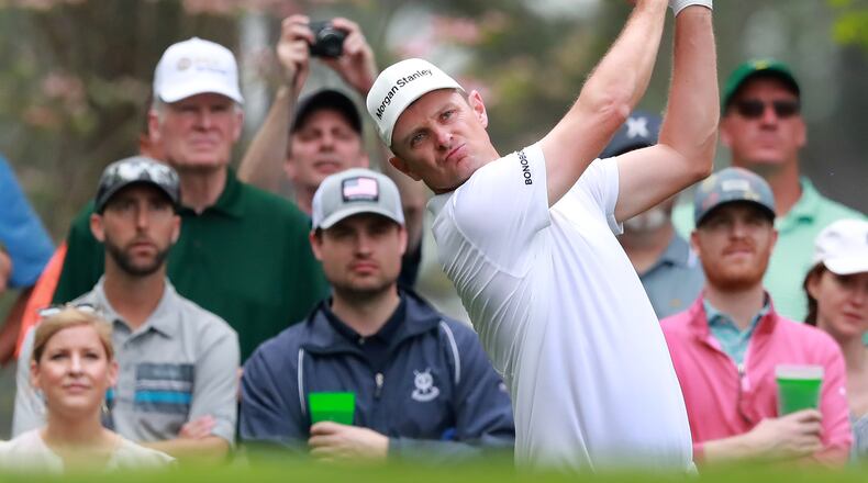 All eyes at No. 4 are on world No. 1 Justin Rose as he tees off on Monday's practice round at Augusta National. (Curtis Compton/ccompton@ajc.com)