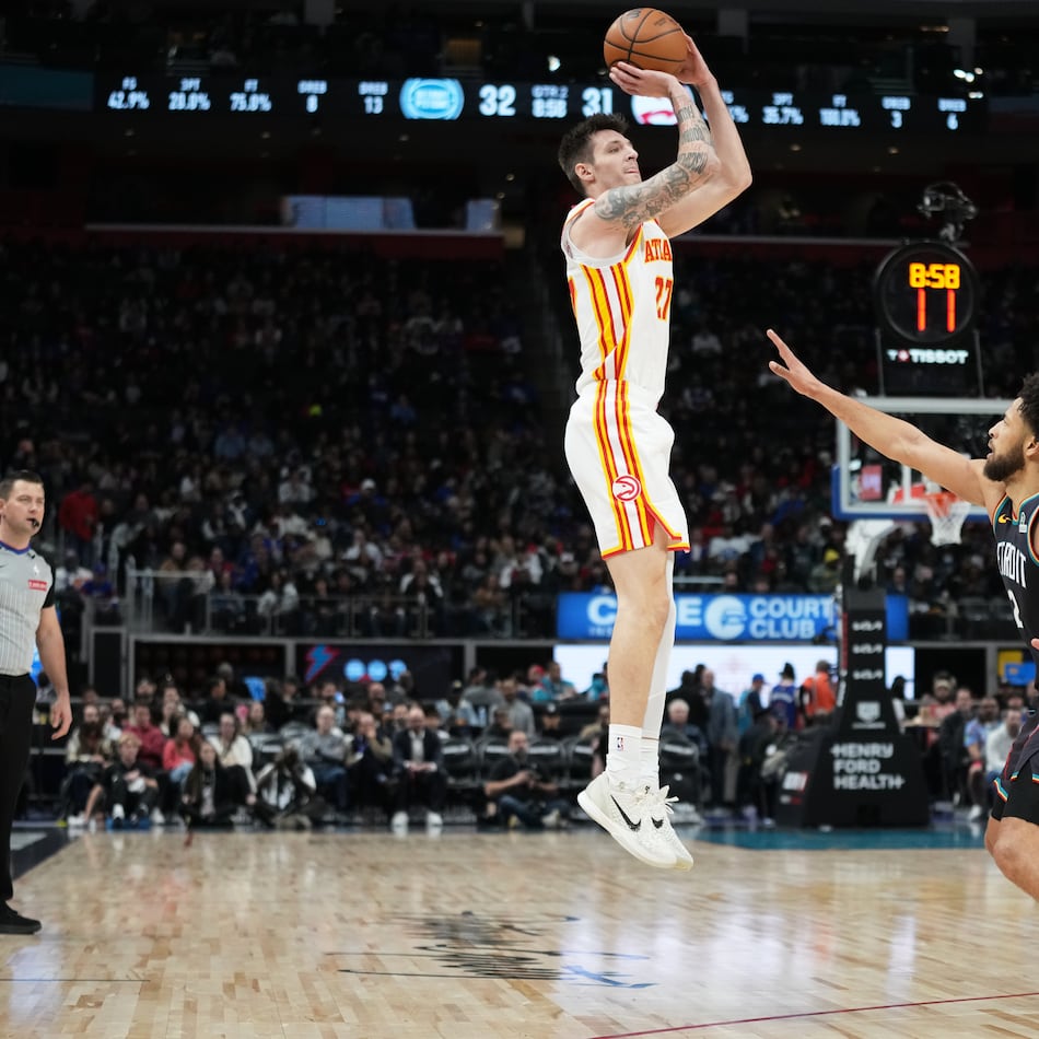 Hawks guard Vit Krejci (left) shoots against Pistons guard Cade Cunningham during the first half on Monday, Dec. 1, 2025, in Detroit. (Ryan Sun/AP)