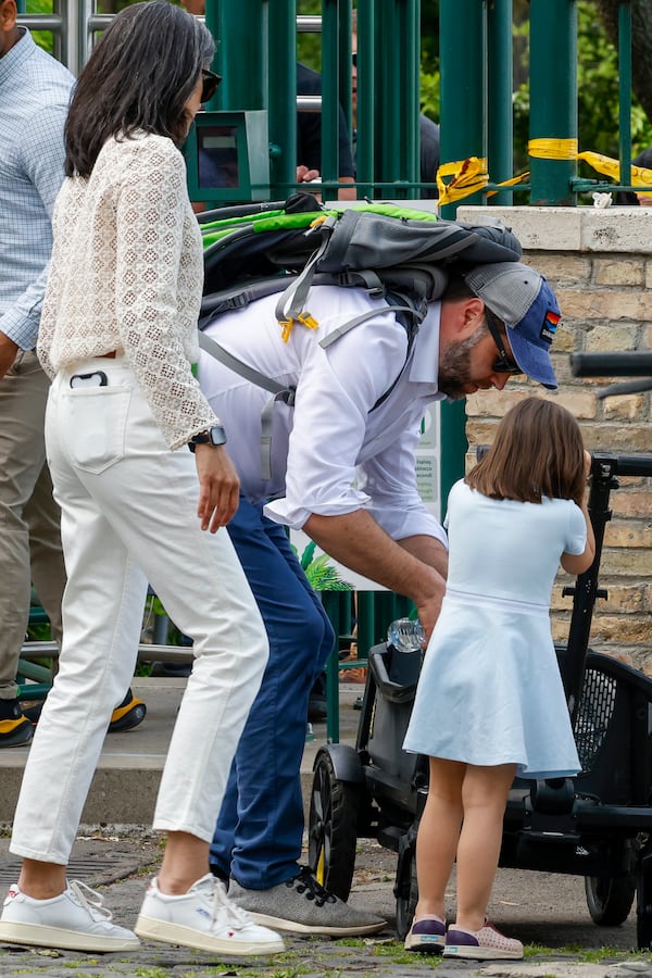 US Vice President J.D. Vance leaves Rome's Botanic Gardens with his wife Usha, left, and their daughter Mirabel, back to camera, Saturday, April 19, 2025. (AP Photo/Riccardo De Luca)