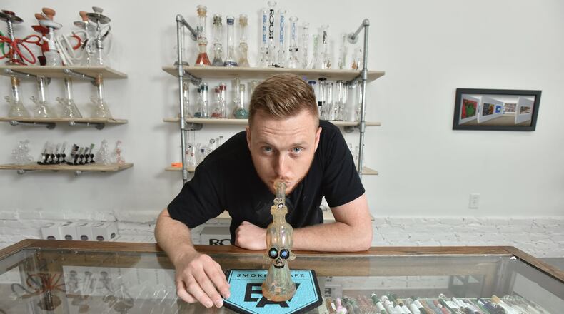 Clayton West, owner of East Atlanta Smoke and Vape, at his shop’s new second location on Moreland Avenue on Friday, April 19, 2019. A grand opening event is set for April 20 from 11 a.m. until 5 p.m. in celebration of Weed Day, also known as “420” because of the date on which the worldwide celebration falls annually. HYOSUB SHIN / HSHIN@AJC.COM