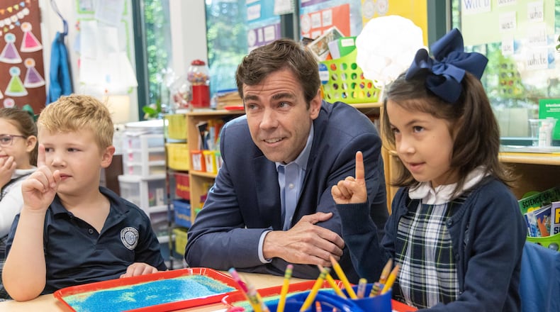 Cornerstone Academy Headmaster Colin Creel (center) watches Katie JohnsonÕs 1st grade class prepare to draw in kinetic sand trays. For the Top Workplace small sized business. PHIL SKINNER FOR THE ATLANTA JOURNAL-CONSTITUTION
Note: he didnÕt want the kids to be identified