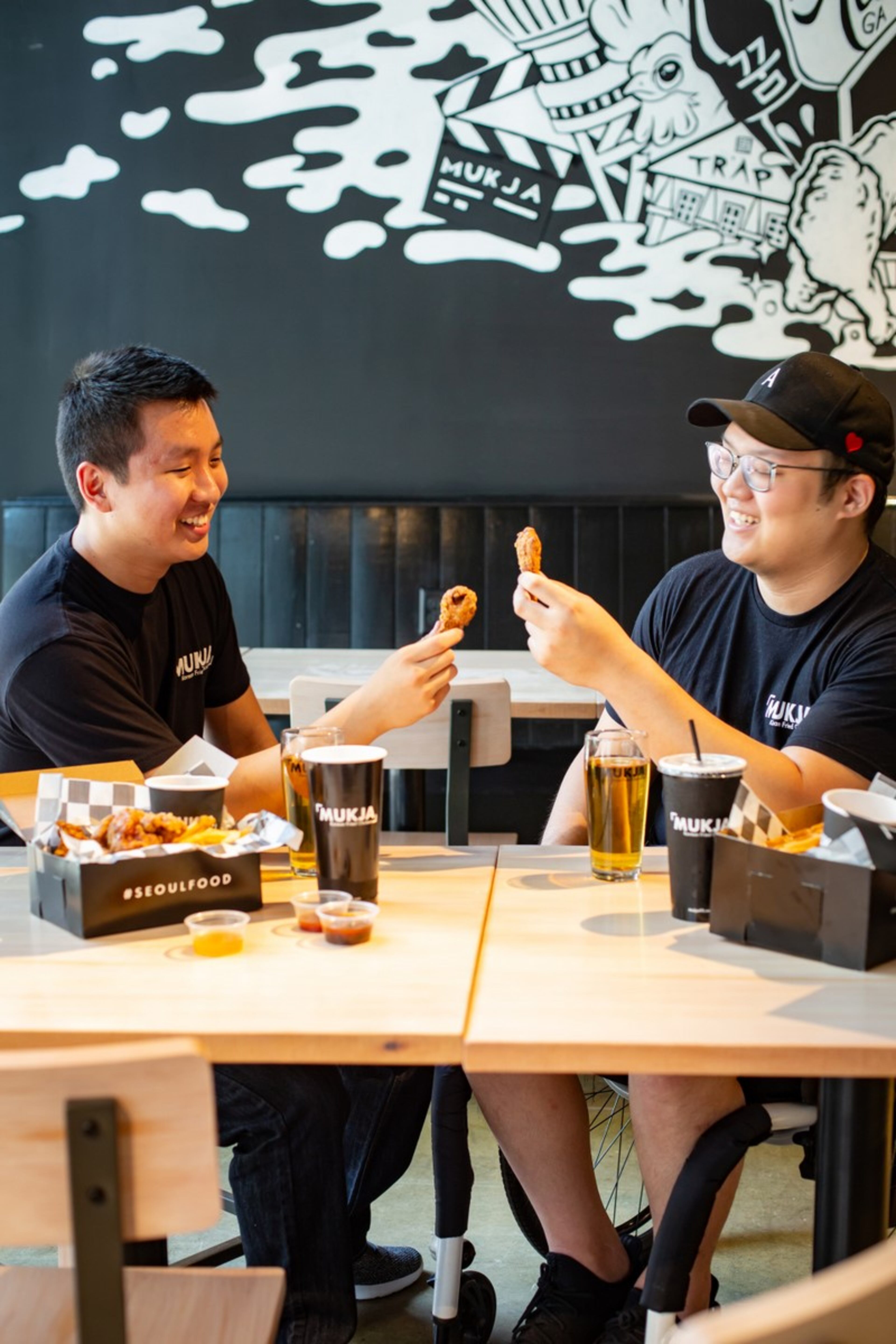 Peter Chung (left) and Sean Chang (right) opened Mukja Korean Fried Chicken in Midtown in 2020. This week, Chang officially closed its doors to focus on his health.
Courtesy of Elena Veselova / Veselovaphoto.com