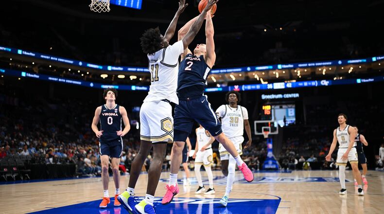 Georgia Tech's Baye Ndongo defends against Virginia's Elijah Saunders in a game Tuesday, March 12, 2025 at the ACC men's basketball tournament in Charlotte, North Carolina. (Photo by Andrew Hancock/Courtesy of the ACC)