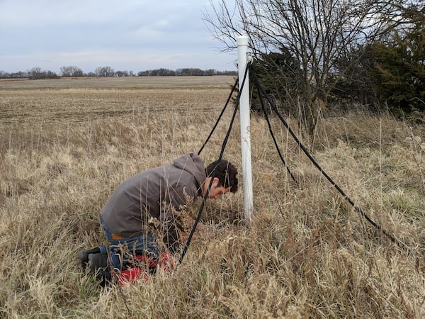 Edward Slevin, a former graduate student at Georgia Tech, installs on of Tech's low frequency radio antennas. Georgia Tech LF Radio Lab