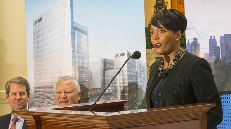 12/12/2018 — Atlanta, Georgia — Georgia Governor-Elect Brian Kemp (left), Governor Nathan Deal (center) listen as Atlanta Mayor Keisha Lance Bottoms (right) speaks during a press conference in the Georgia State Capitol building in Atlanta, Wednesday, December 12, 2018. During the presser, Fortune 500 company Norfolk Southern officially announced that they will be moving their headquarters to Atlanta. They will be building in Atlanta’s Midtown community. (ALYSSA POINTER/ALYSSA.POINTER@AJC.COM)