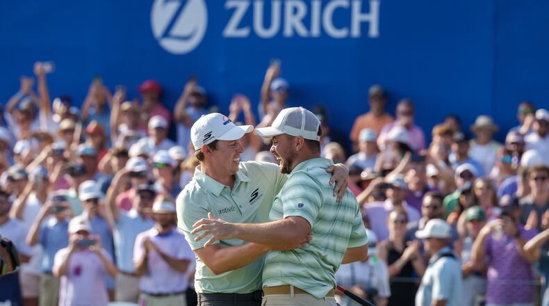 Alex Fitzpatrick, right, of England, reacts after sinking a birdie putt and winning the tournament with his brother Matt Fitzpatrick, left, during the final round of the PGA Zurich Classic of New Orleans golf tournament, Sunday, April 26, 2026, in Avondale, La. (AP Photo/Matthew Hinton)