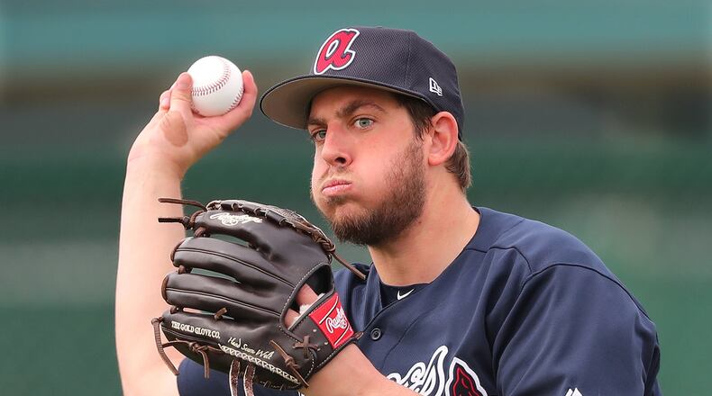 Braves pitcher Aaron Blair looks to throw during a spring training workout on Feb. 15. Curtis Compton/ccompton@ajc.com
